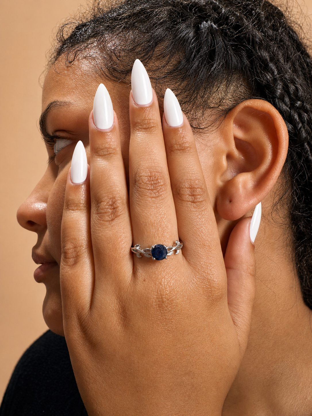 925 sterling silver solitaire ring with a round sapphire.