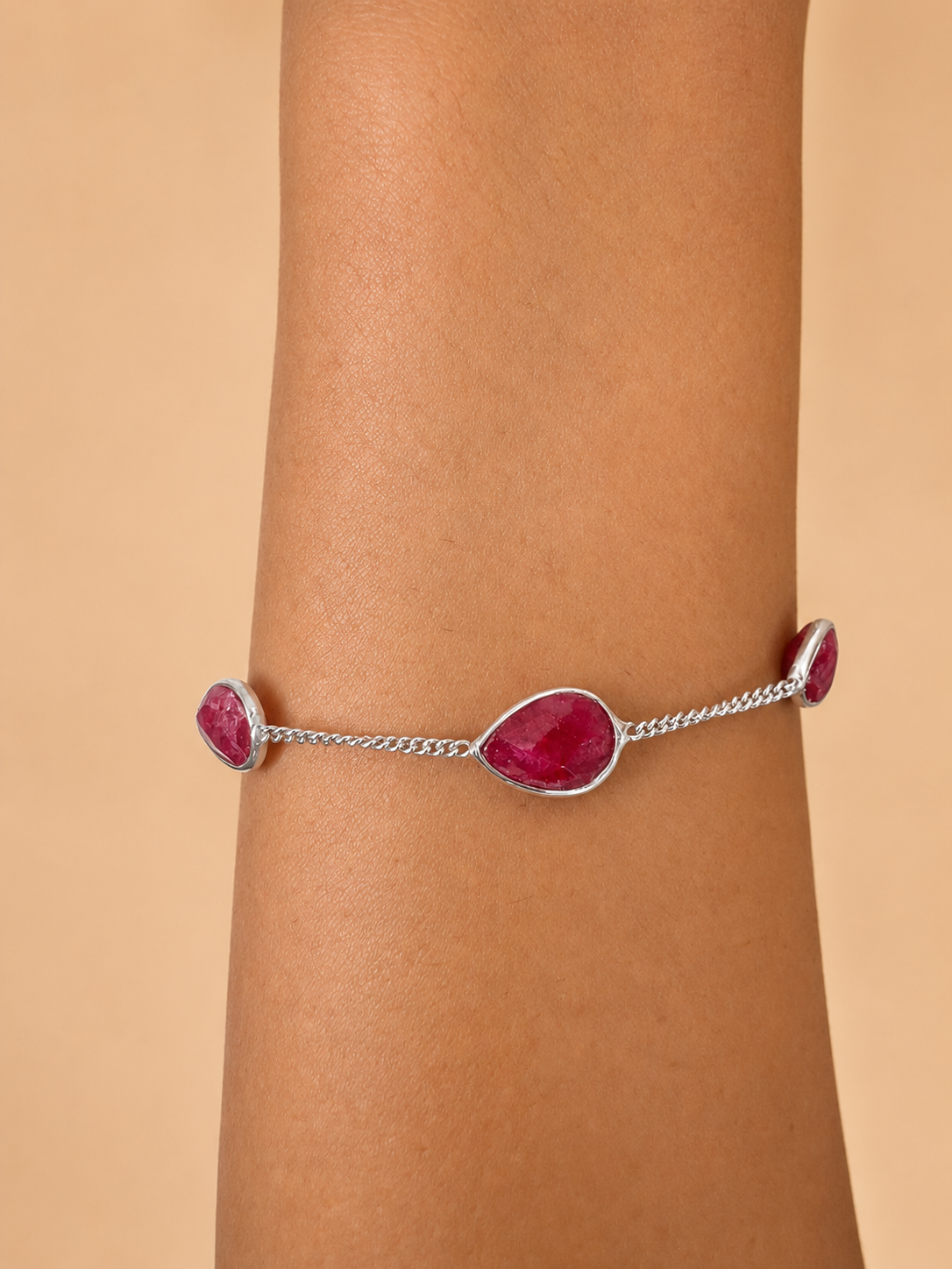 925 sterling silver bracelet with teardrop-shaped rubies.