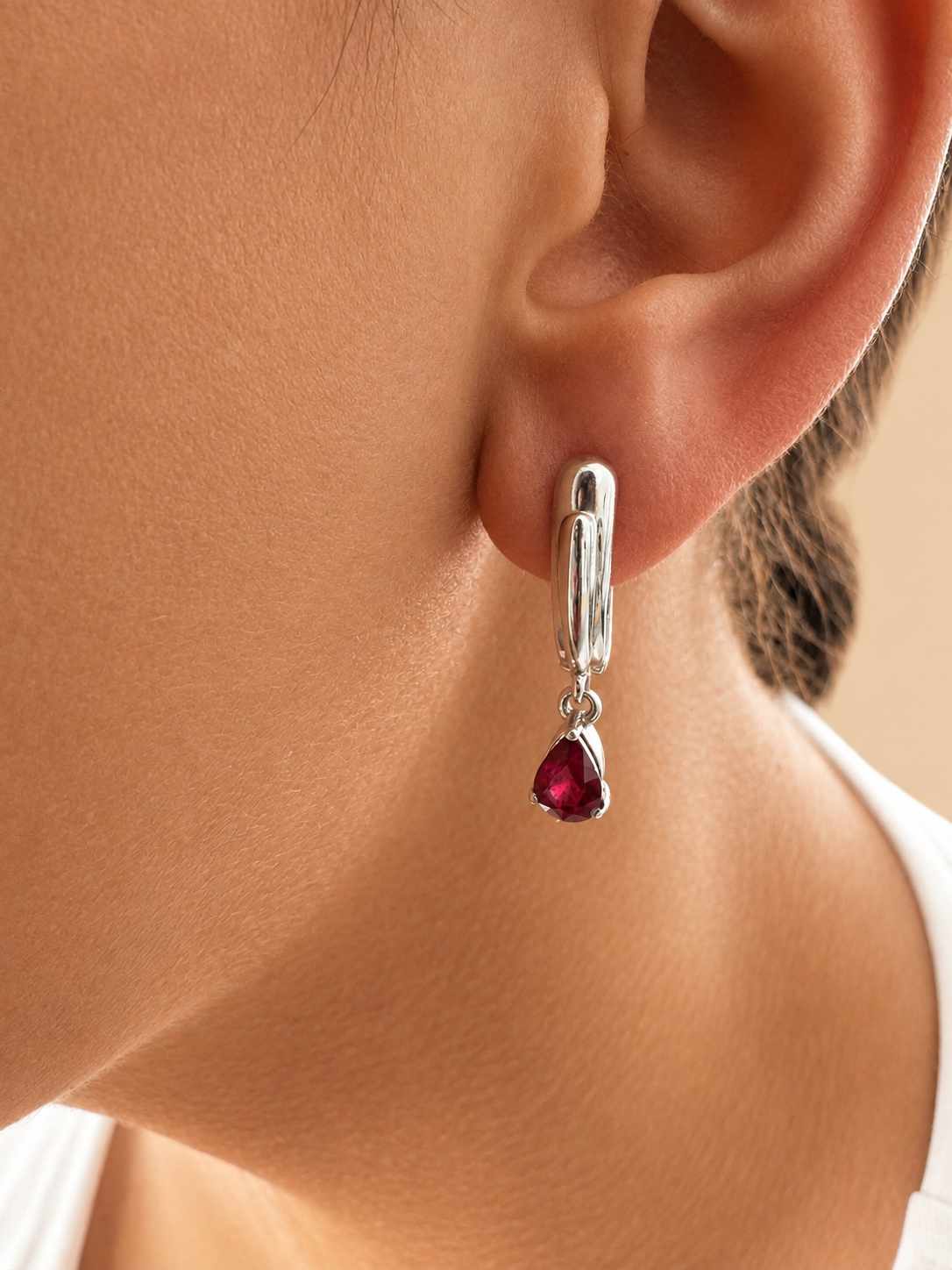 925 sterling silver earrings with a teardrop-shaped ruby