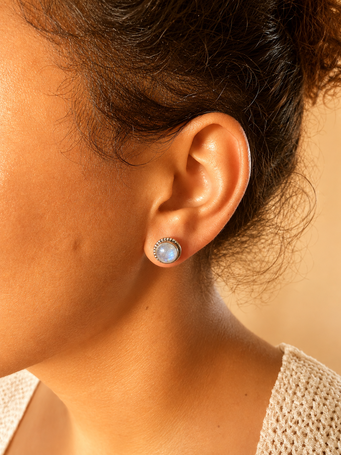 925 sterling silver earrings with round moonstone cabochons.