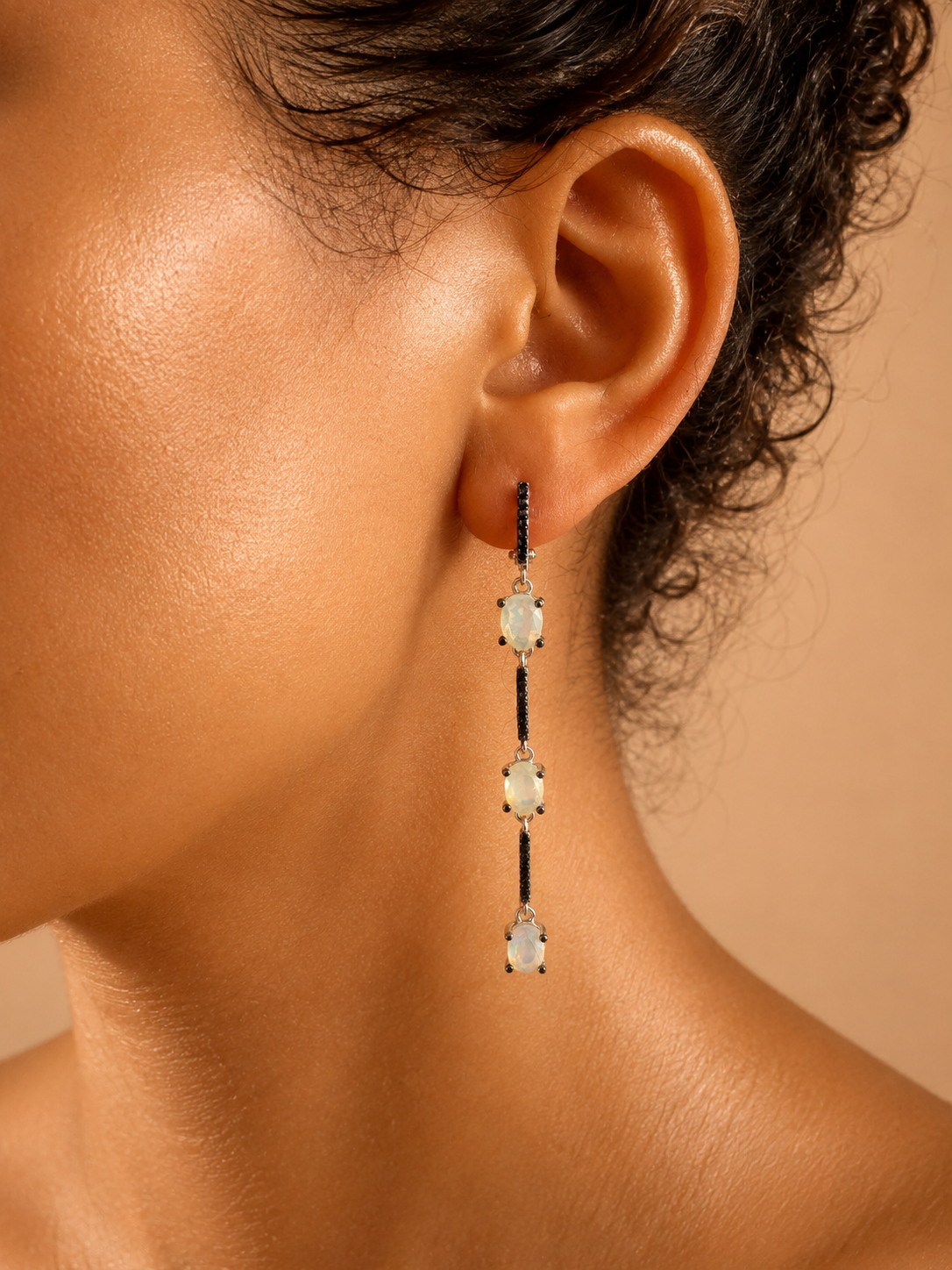 925 sterling silver earrings with black sapphires and opal.