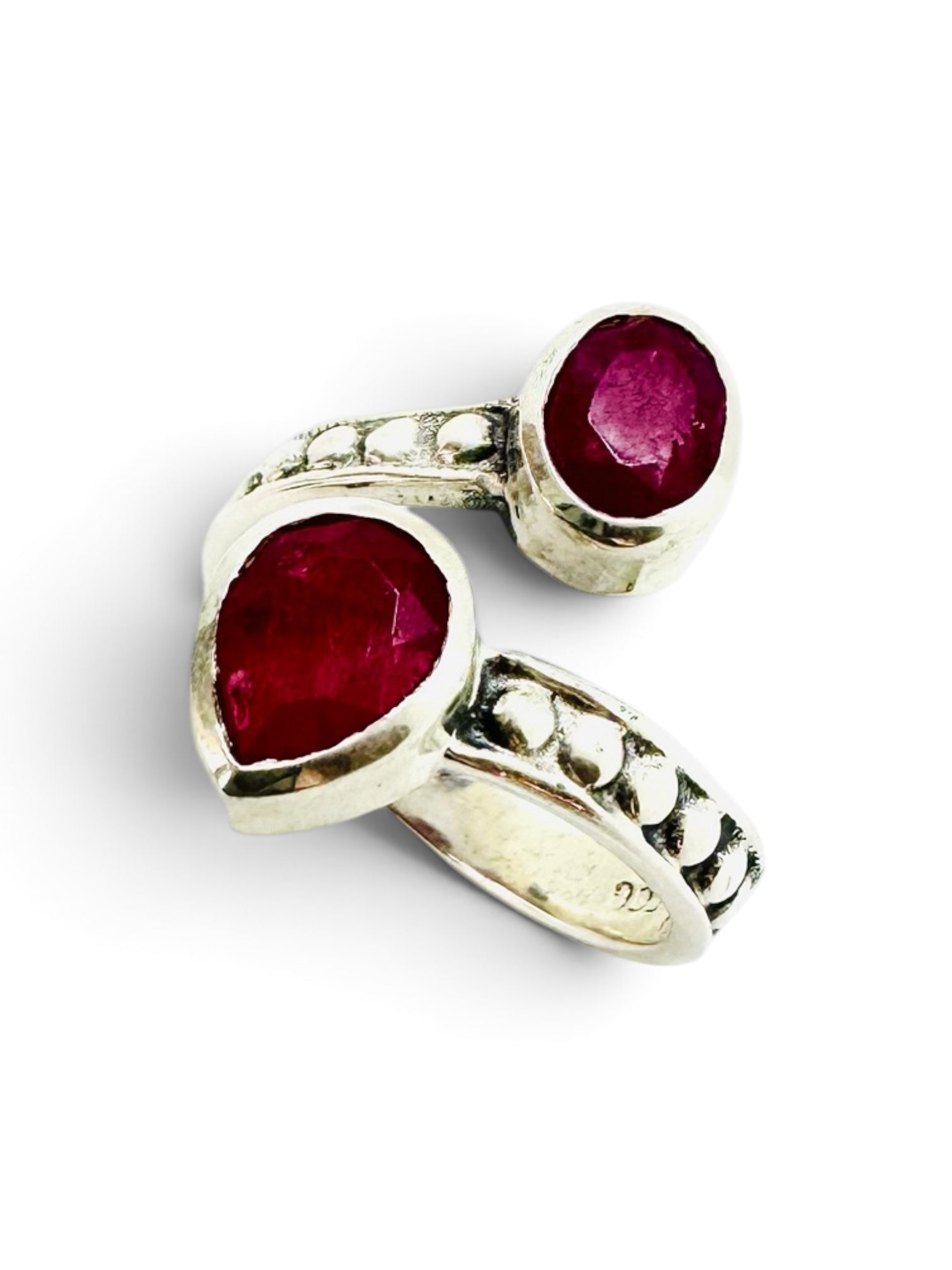 925 sterling silver ring with an oval ruby and a teardrop setting.
