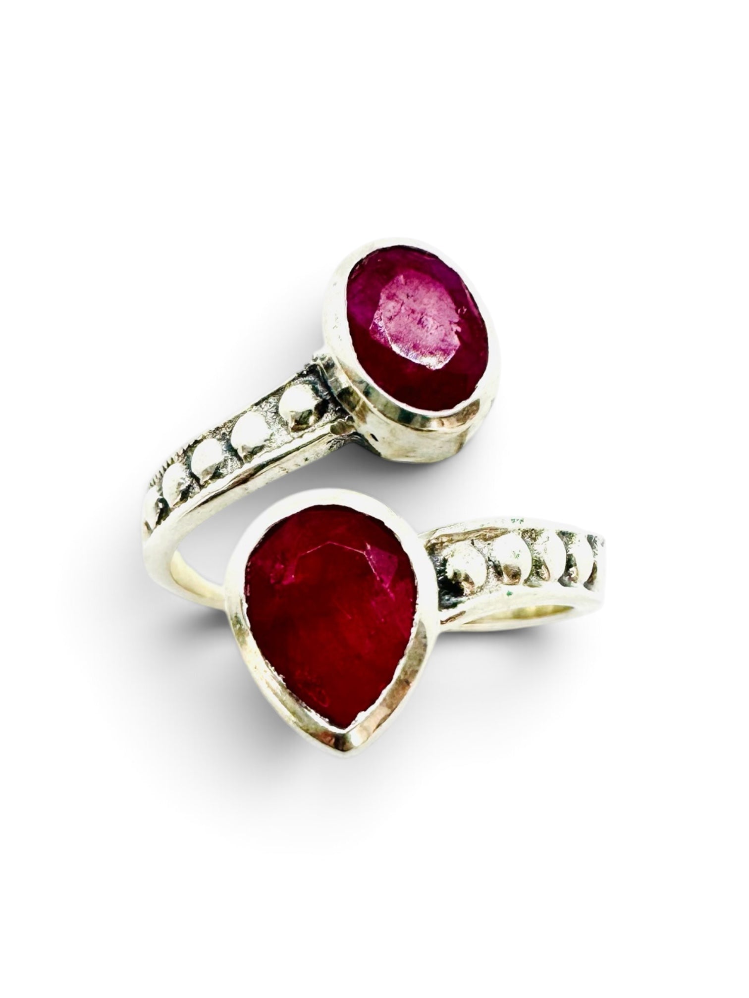 925 sterling silver ring with an oval ruby and a teardrop setting.