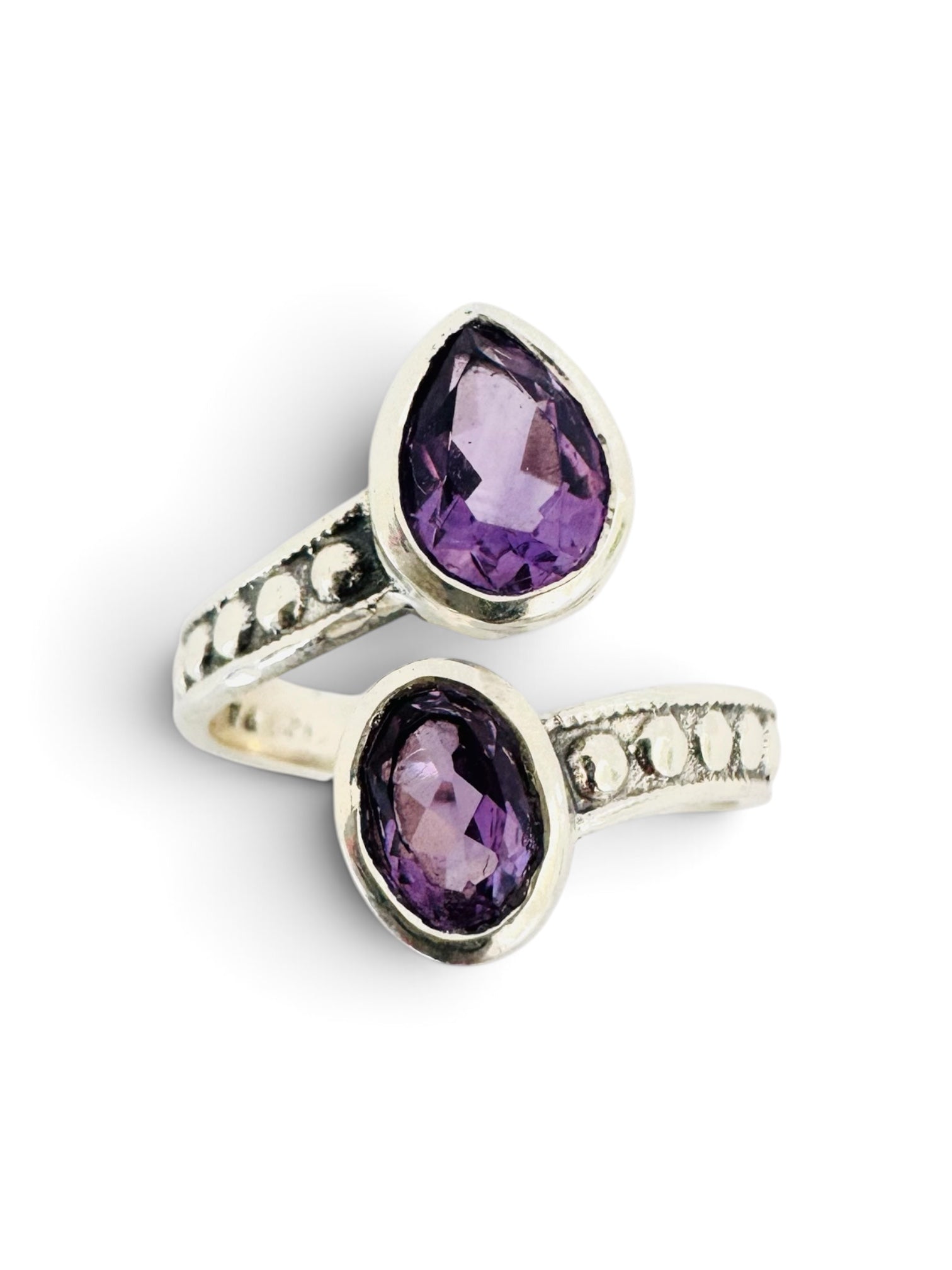 925 sterling silver ring with a round and an oval amethyst.