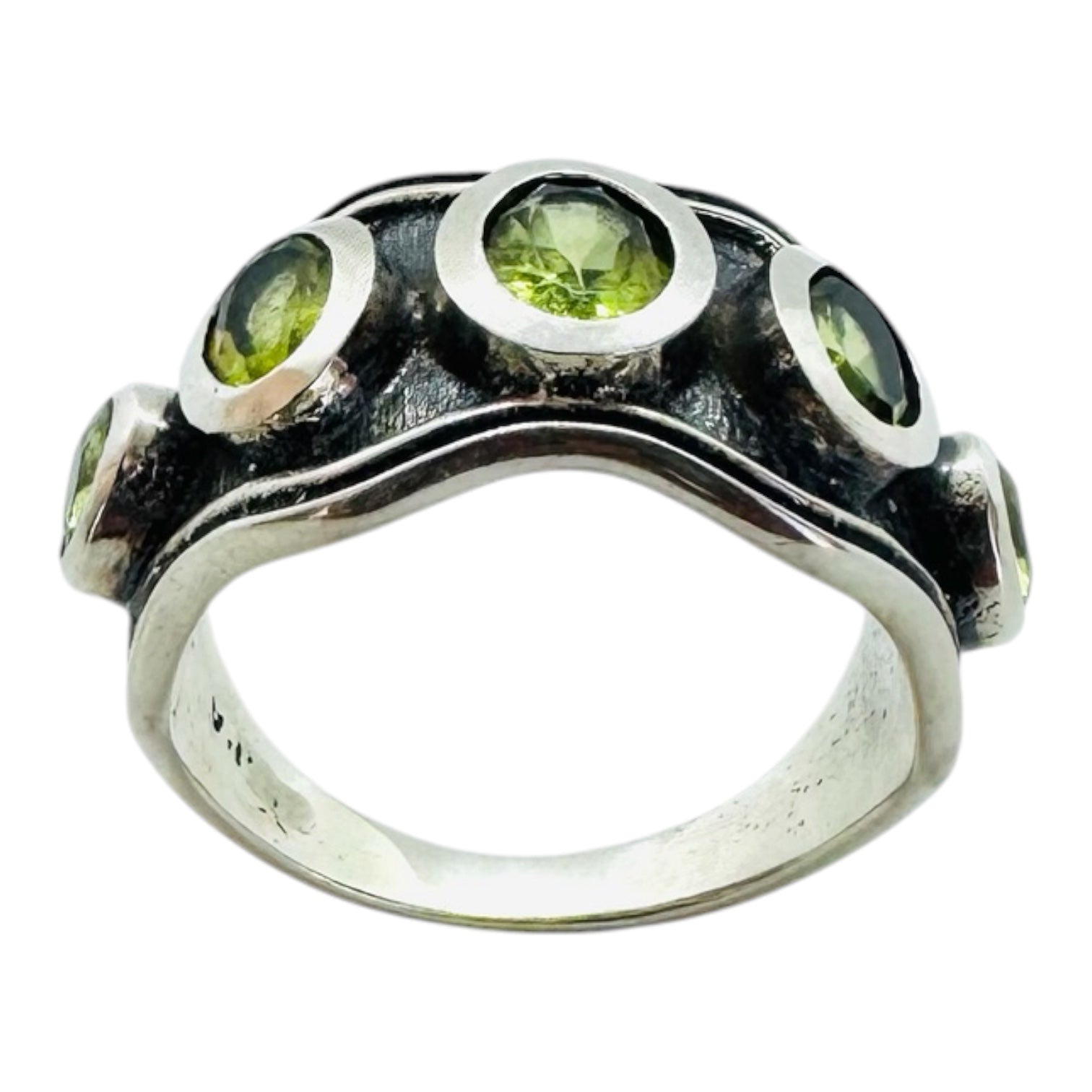 Silver ring with five oval peridots
